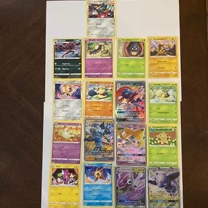 Opened Pokémon cards. See names on the picture